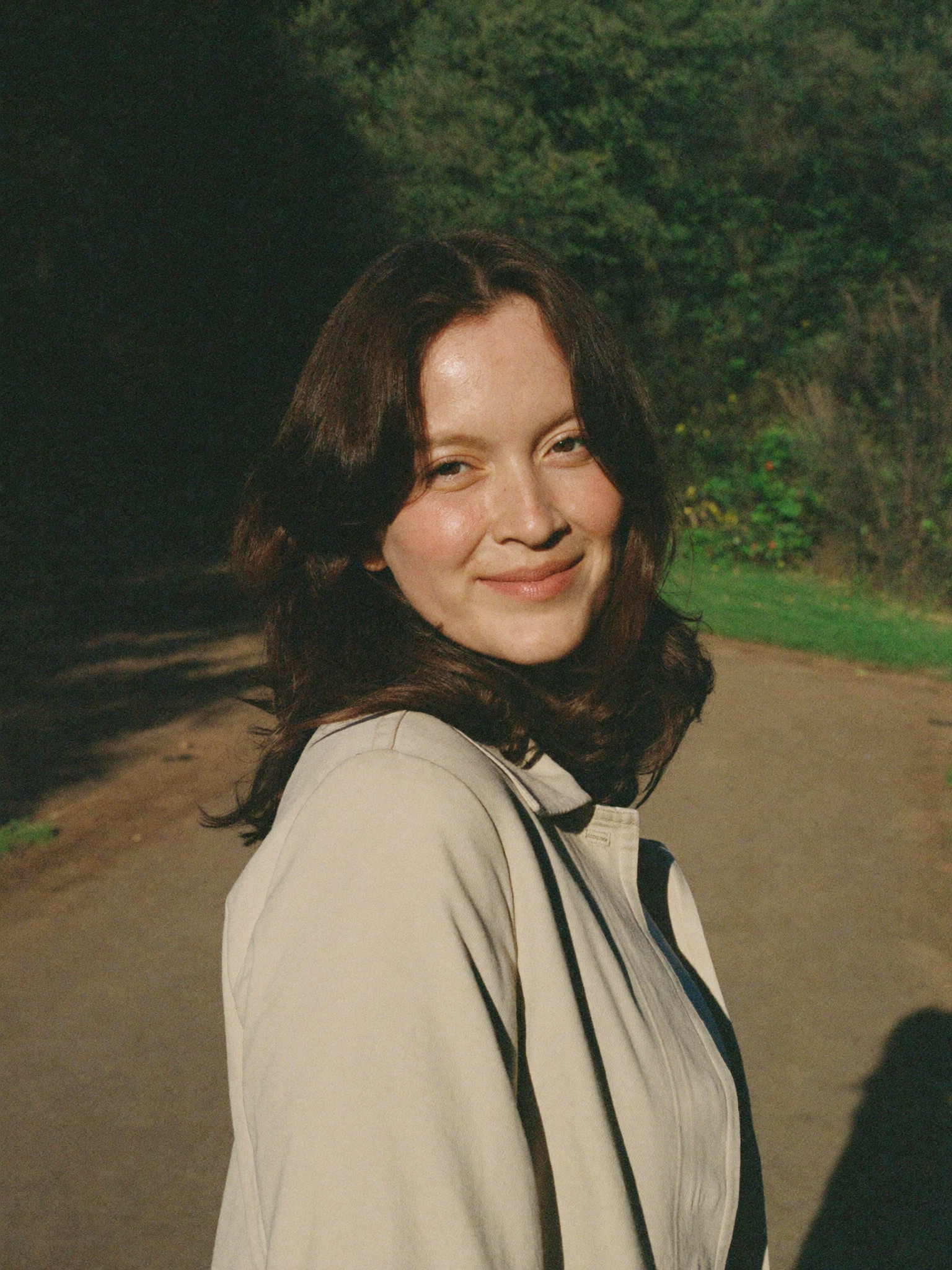 Sarah walking outdoors in golden morning light, lighter and energized