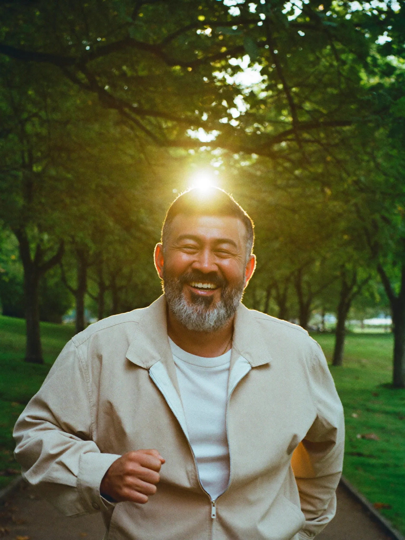 Marcus walking outdoors in golden morning light, lighter and energized